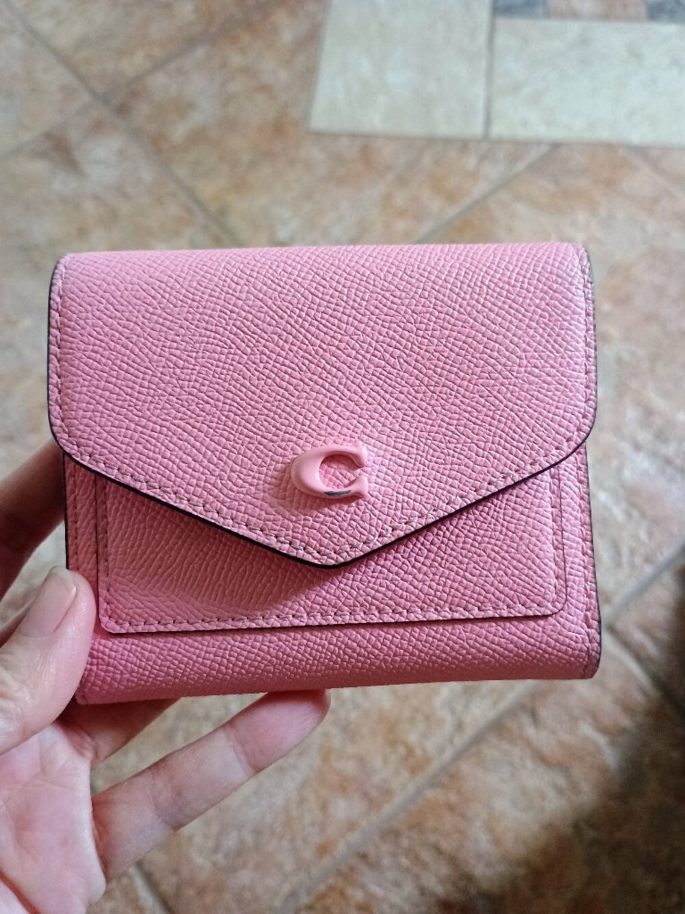 Pink Coach pebbled leather wallet